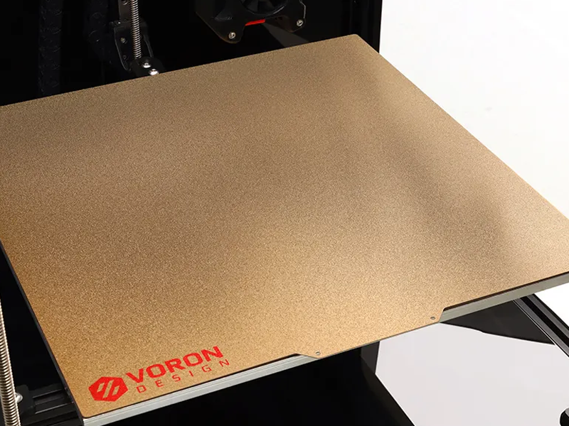 The build surface and build plate on the Voron Trident 3D printer